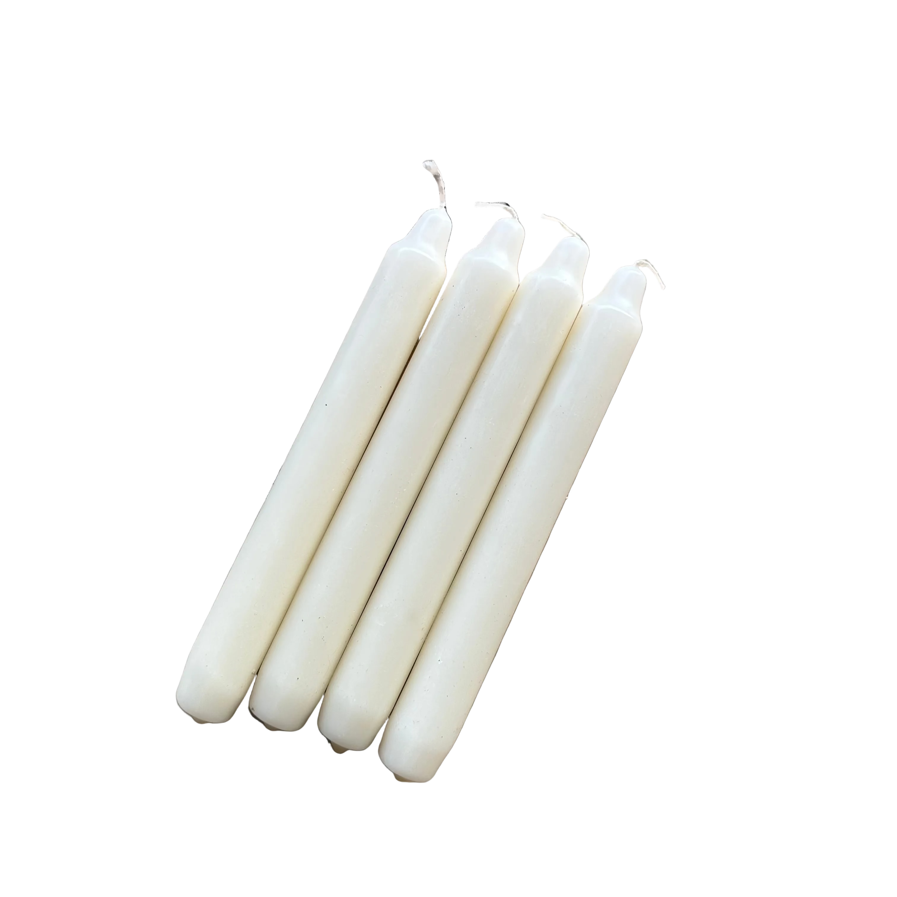 White candles on a wooden surface with 'Cantrip Candles' packaging.